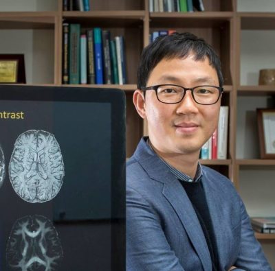 Photograph of Associate Professor Jongho Lee standing in his office.